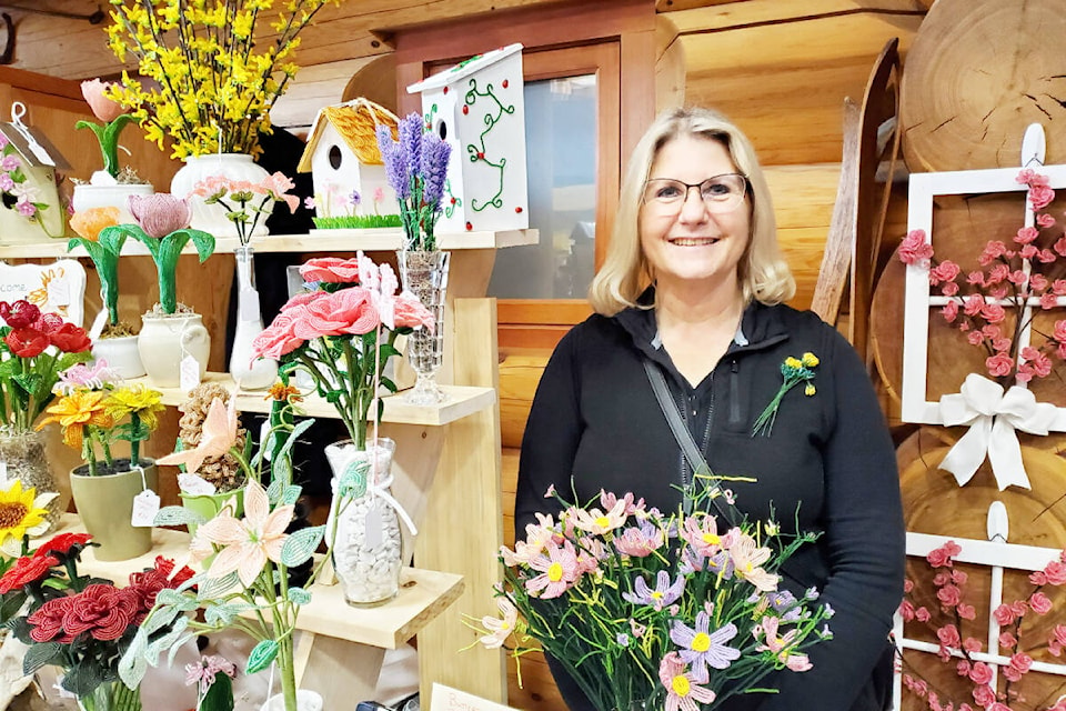 Heidi Butters with her beaded flower arrangements at the Made in the Cariboo Craft Fair at the Williams Lake Visitors Centre on Saturday, Nov. 26. (Monica Lamb-Yorski photo - Williams Lake Tribune)