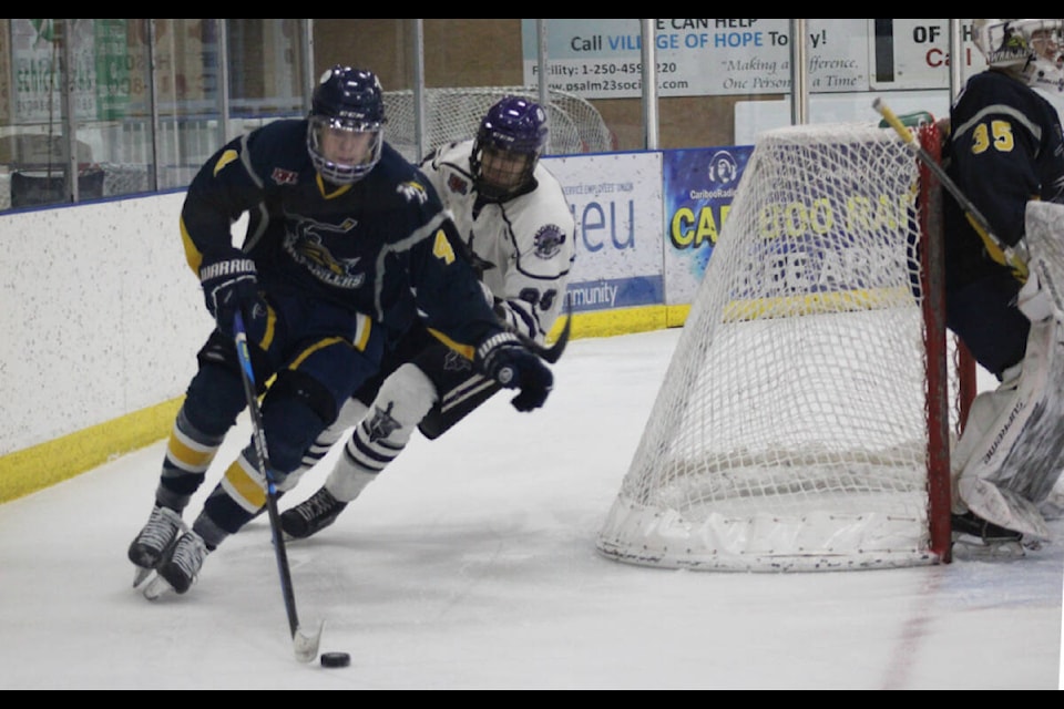 100 Mile House Wranglers Tyler Smoluk takes the puck out from behind the Wrangler net. (Fiona Grisswell photo - 100 Mile Free Press)