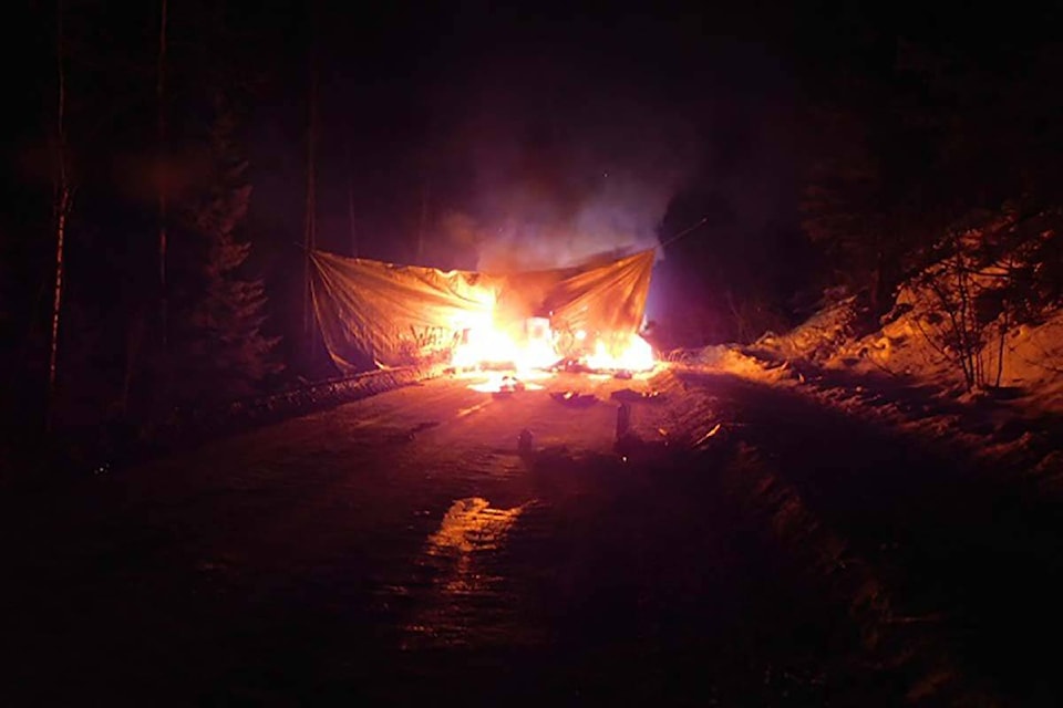 BC RCMP say a group of people threw smoke bombs and fire lit sticks at police on Feb. 17, 2022, when officers responded to reported damage at a Coastal GasLink work site. (Photo courtesy of BC RCMP)