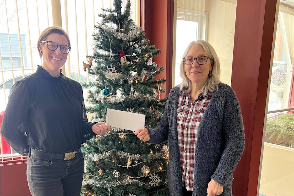 Ruth Lloyd, left, and Monica Lamb-Yorski accept the gift certificate as the grand prize winners of the Downtown Williams Lake Window Decorating contest. (Sherry Yonkman photo)