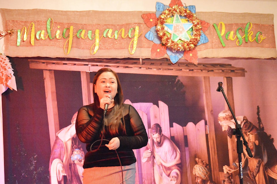 Celeste Landicho sings O Holy Night during the Filipino Christmas Party held Saturday, Dec. 17 at Sacred Heart Catholic School hall. (Monica Lamb-Yorski photo - Williams Lake Tribune)