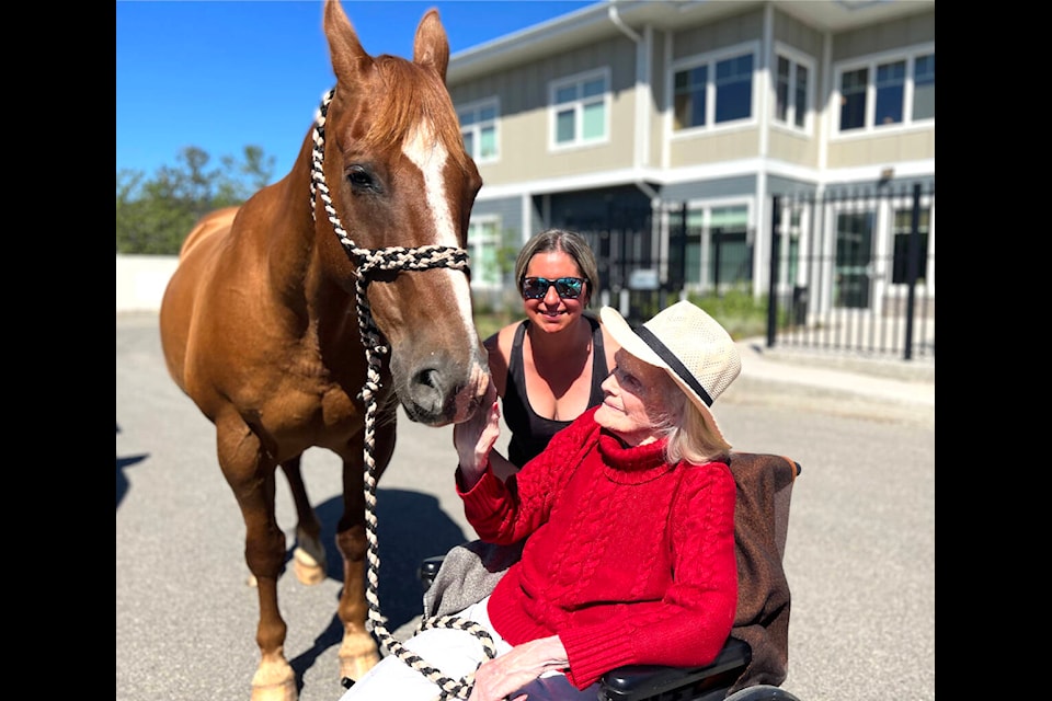 Rayell Peterson brings her horse to visit Gerry Bracewell at Age Care in Williams Lake. Bracewell recently celebrated her 100th birthday with a trip to the family business, Bracewell Lodge, and the publishing of a new book on her life as a pioneer and guide in the Chilcotin. (Angie Mindus photo - Williams Lake Tribune)
