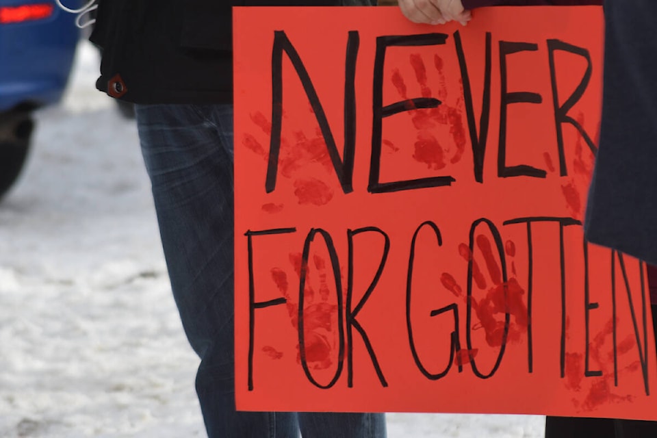 Dozens of signs were held at the Willow Inn in Quesnel on Thursday, Jan. 20 where the body of 33-year-old Carmelita Abraham was recently found. A Quesnel man is facing charges of murder and indignity to human remains. (Rebecca Dyok photo)