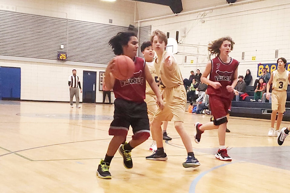 LCSS Grade 8 boys Roman Aulakh with the ball, left, and Ethan Bluda, right, race down the court in a game against St. Ann’s Academy at Barriere Secondary School on Saturday, Jan. 7. (Photo submitted)