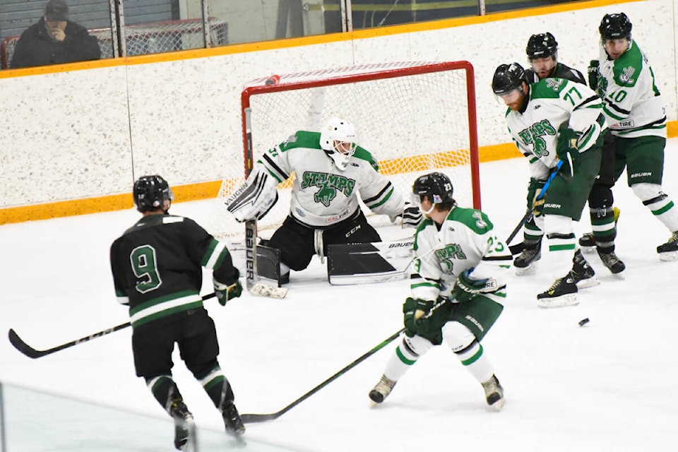 Stamps netminder Willie Sellars shifts his position to block one of a series of shots Saturday night (Jan. 14) during a game against the Nechako North Stars. (Angie Mindus photo - Williams Lake Tribune)