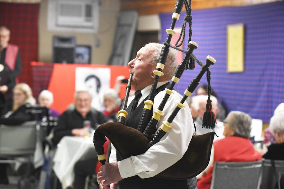 Doug White still manages to blow some air through the bagpipes for Legion Branch 139 on Robbie Burns night. (Ruth Lloyd photo - Williams Lake Tribune)