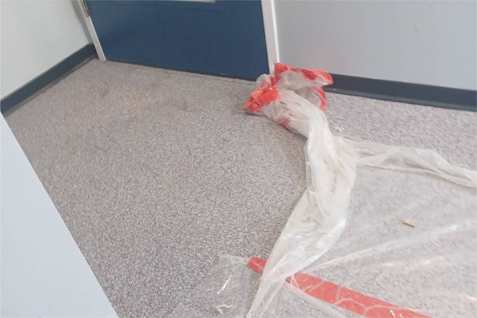 A piece of plastic covering carpet at the entrance to a stairwell. (Photo Submitted)