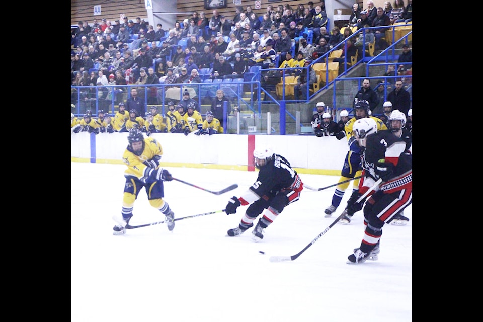 100 Mile House Wrangler Mason Pincott takes a shot at the Summerland Steam’s net. (Patrick Davies photo - 100 Mile Free Press)