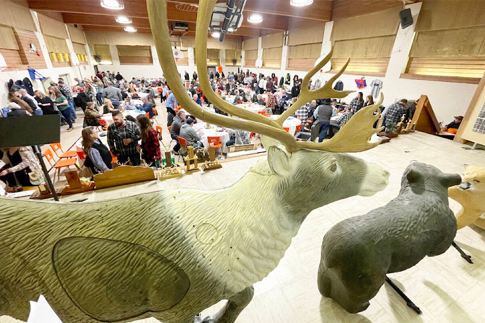 The Sacred Heart Hall was crowded with adventurous diners for the Williams Lake Sportsmen’s Association game banquet on Feb. 4, 2023, while three-dimensional archery targets stood watch from the stage. (Ruth Lloyd photo - Williams Lake Tribune)