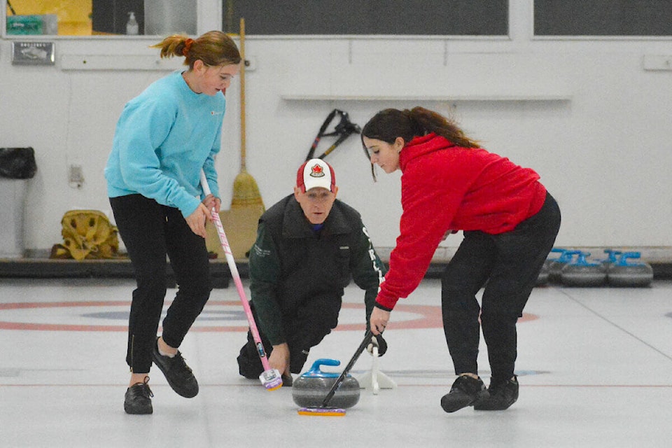 Williams Lake curlers Kelsey Camille, left, coach Rick Miller, and Talana Brown-John practise in anticipation of competing for the Zone 8 U16 team at the BC Winter Games. (Monica Lamb-Yorski photo - Williams Lake Tribune)