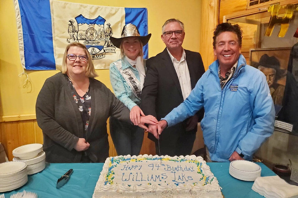 Kelly Walls, Museum of the Cariboo Chilcotin president, left, Karena Sokolan, Williams Lake Stampede Royalty, Lorne Doerkson, Cariboo Chilcotin MLA and city councillor Scott Nelson cut the cake for Williams Lake’s 94th birthday. (Monica Lamb-Yorski photo - Efteen)