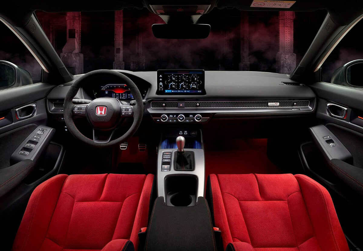 The Civic Type Rs interior gets red seats and carpet and a special page for the display that monitors vehicle performance. Note the standard six-speed manual transmission. PHOTO: HONDA