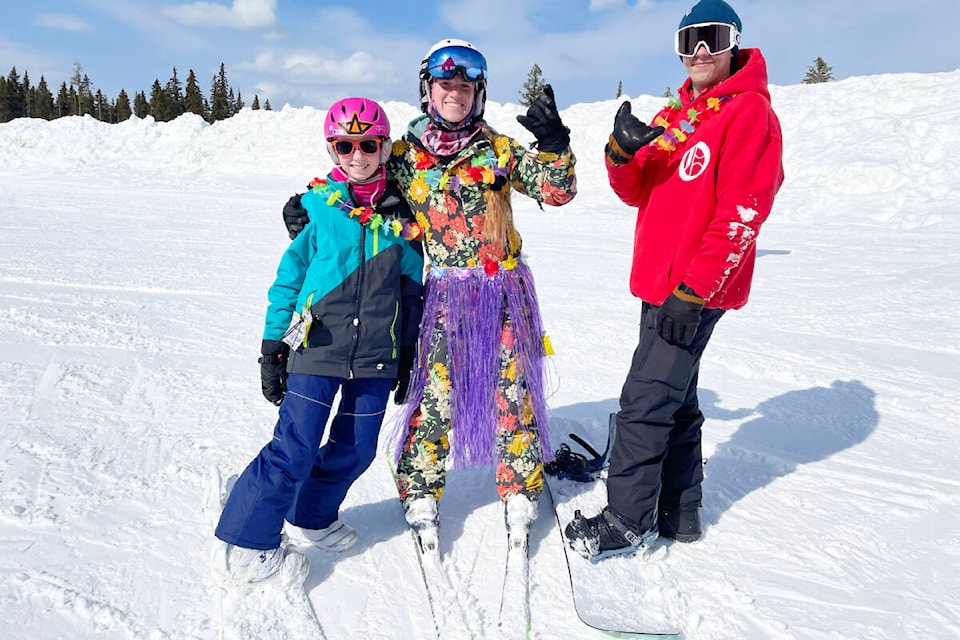 Samantha Zilcosky, from left, Kennady Dyck, and Brady Phillips were in the theme spirit for Beach Days at Mount Timothy on March 18, 2023. There were photo ops, sunshine and snow for spring break at the resort. (Ruth Lloyd photo - Williams Lake Tribune)