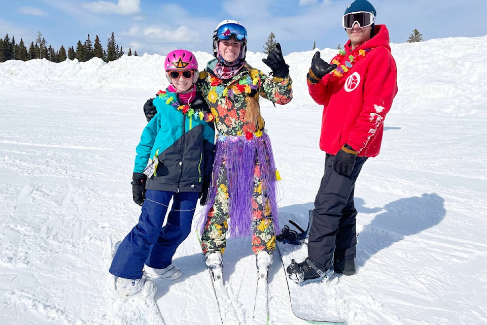 Samantha Zilcosky, from left, Kennady Dyck, and Brady Phillips were in the theme spirit for Beach Days at Mount Timothy on March 18, 2023. There were photo ops, sunshine and snow for spring break at the resort. (Ruth Lloyd photo - Efteen)