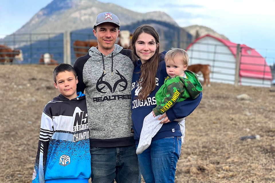 Chris Jim is making a life for himself at the family ranch, with sons Graham, 9, and Deakon, 17 months, and partner Cassidy Kurtenacker. (Angie Mindus photo - Black Press Media)