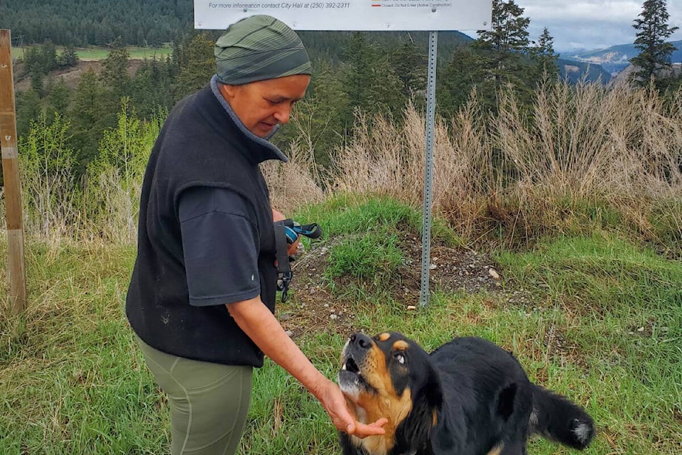 Jackie Pooni and her dog Millie about to head out for a walk on the Williams Lake river valley trail which partially reopened to the public Monday, May 1. (Monica Lamb-Yorski photo - Williams Lake Tribune)