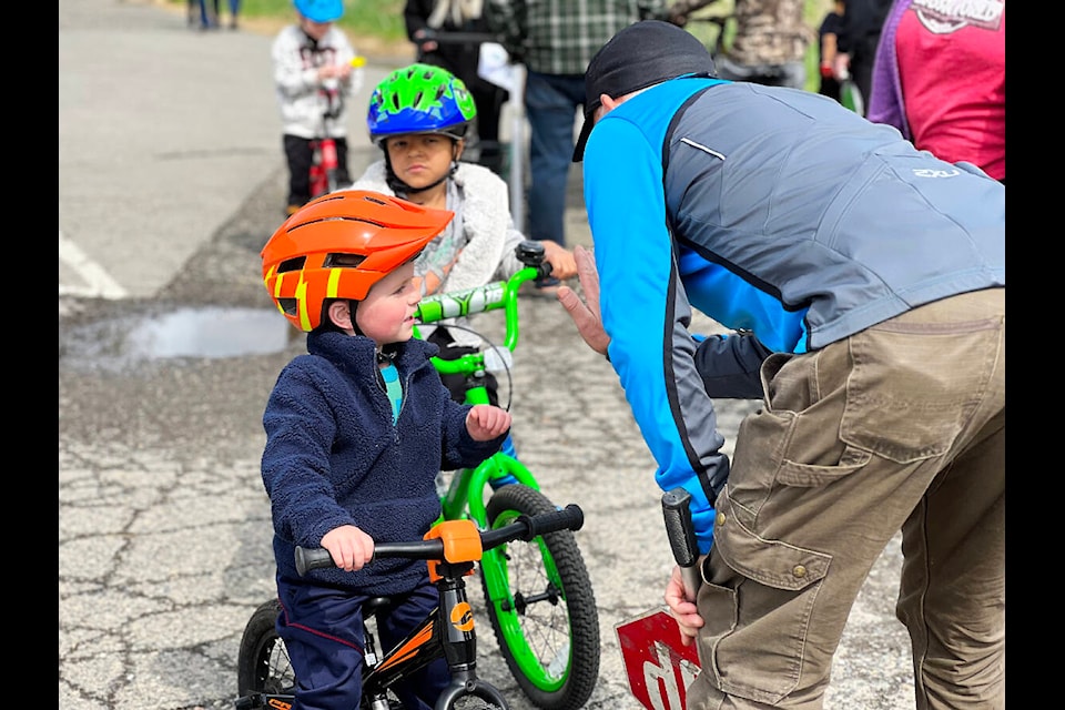 Everest Logan, 2, and his cousin Elias Harrison, test their stopping skills with instructor and volunteer Rick Miller. (Angie Mindus photo - Efteen)