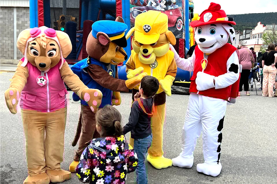 Paw Patrol mascots greet excited children at the Realm of Toys Spring Festival downtown Sunday afternoon, May 7. (Angie Mindus photo - Efteen)