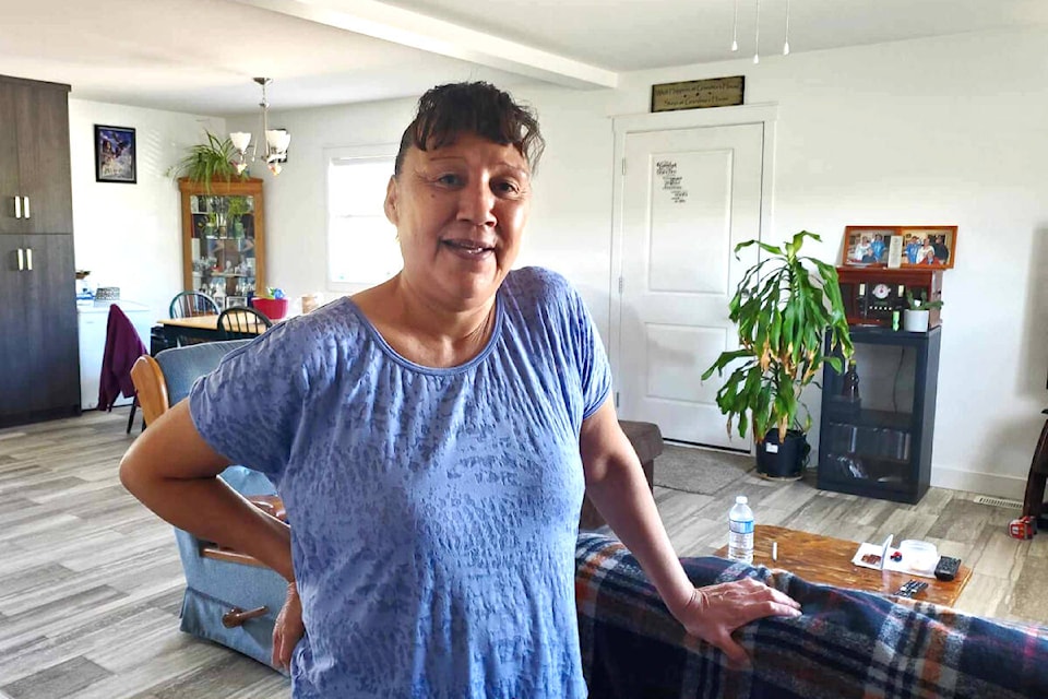 Mary Tenale is enjoying her new home at Tl’esqox First Nation thanks to a community-led initiative to create more housing for community members. (Monica Lamb-Yorski photo - Williams Lake Tribune)