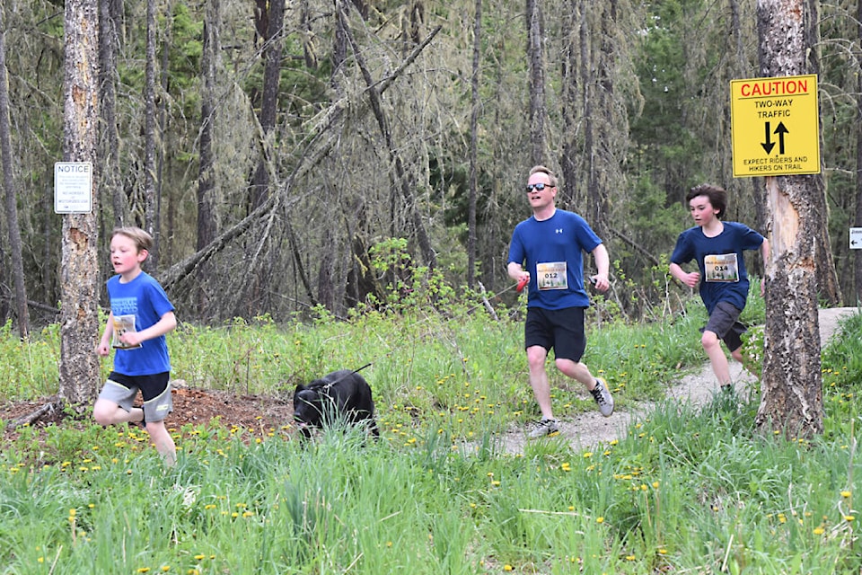 32802371_web1_220602-WLT-trail-run-mud-puddle-foxtrails_1