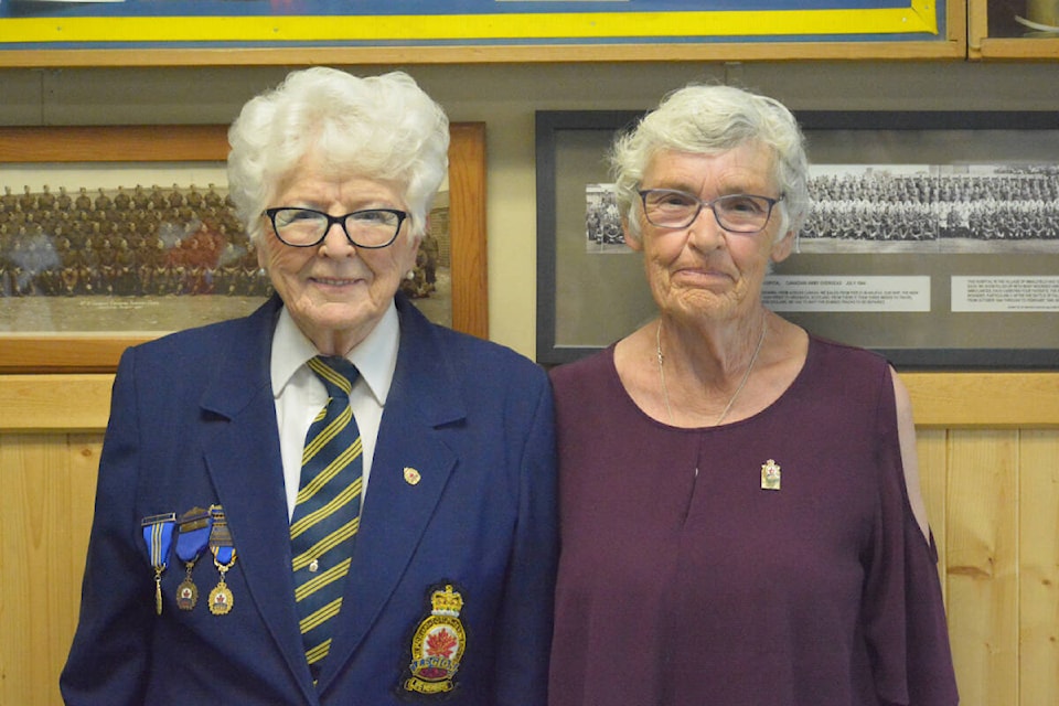 Legion president Joyce Norberg, left, presents Heather Isnardy with her 50-year membership with the Royal Canadian Legion. (Monica Lamb-Yorski photo - Williams Lake Tribune)