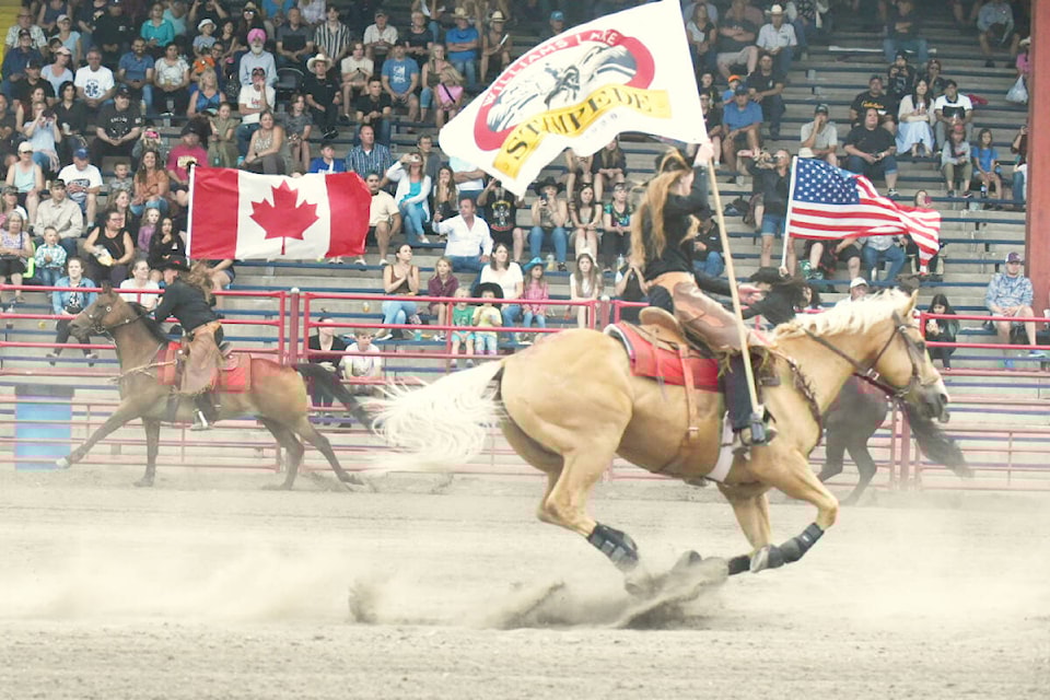 Wild West Riders ride in the flags to help kick off the Thursday evening performance of the 95th Annual Williams Lake Stampede. (Ruth Lloyd photo - Efteen)