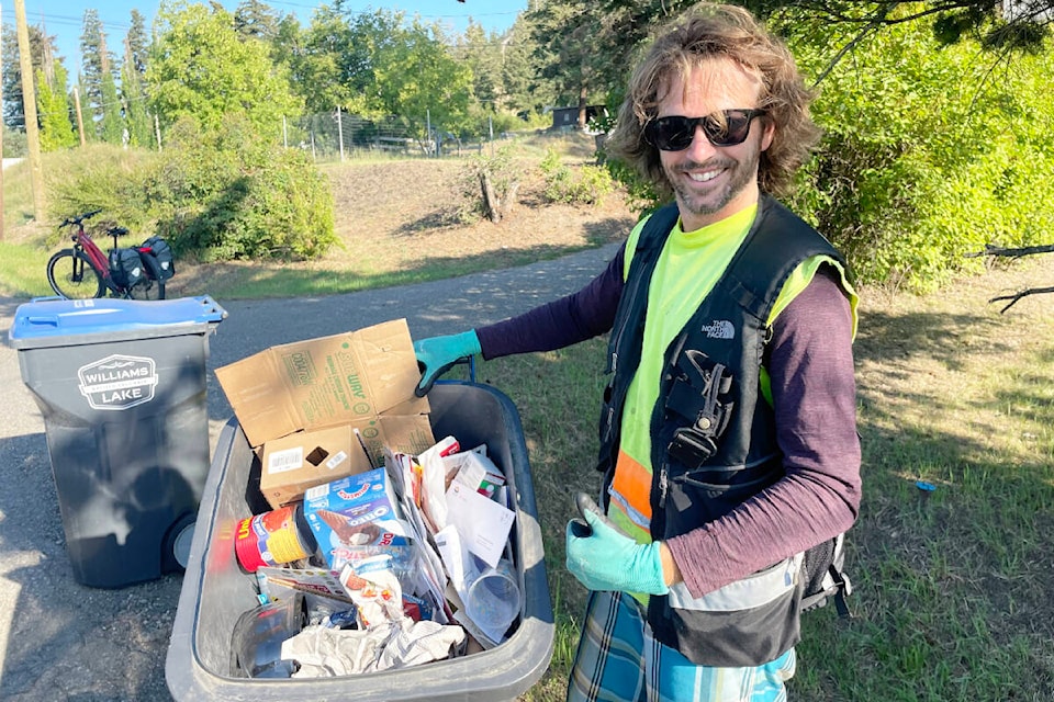 Oliver Berger gives a good recycling bin the thumbs-up for being full of clean recyclables with very little contamination. (Ruth Lloyd photo - Williams Lake Tribune)