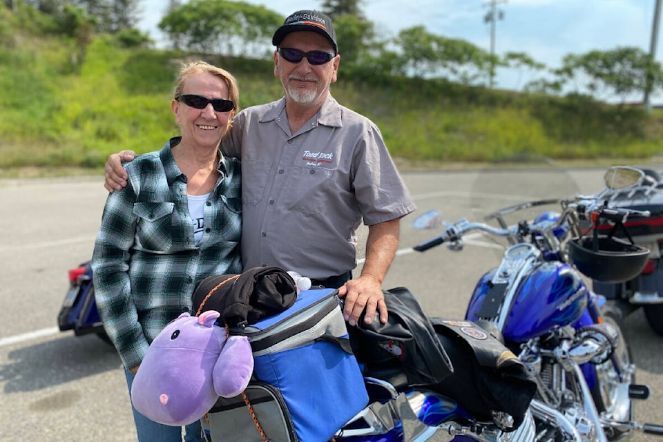 Betty Melo and Eric Larsen took part in the Christmas in July 2023 Toy Run on Saturday, July 22, with the Cariboo Motorcycle Association. Their hippo, along with many other toys, will be donated to the Chiwid Transitional House and the Boys and Girls Club. (Kim Kimberlin/Efteen)