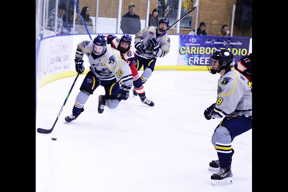 100 Mile House Wrangler Nathan Bohmer hustles the puck down the ice with the Kamloops Storm in hot pursuit during the 2022/2023 season. (Patrick Davies photo - 100 Mile Free Press)