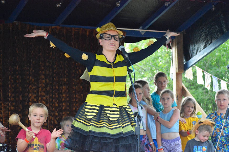 Hana Kamea from Tatlayoko Valley is joined on the stage by some young audience participants during her Bumblina act at Arts on the Fly, Saturday, July 22. Kamea is a singer-songwriter, dance therapist, counsellor and filmmaker. See A11 for more on the festival. (Monica Lamb-Yorski photo - Efteen)
