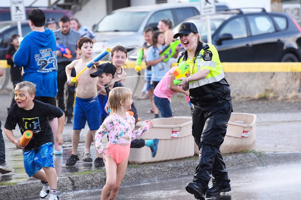Paramedic Tara Cloutier lets off some steam at the BGC Williams Lake Club’s 21st Annual Street Party Wednesday evening, Aug. 30 where a water fight had everyone laughing. (Angie Mindus photo - Efteen) (Angie Mindus photos - Tribune)