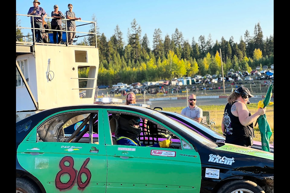 Annaka Westwick gets racers to line up to the track at Thunder Mountain Speedway Saturday evening for the last racing event of the season. (Angie Mindus photo - Efteen)