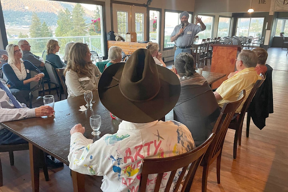 Balwinder (Bob) Singh Sunner, back centre, speaks to his fellow volunteers and honoured guests at an appreciation dinner for Citizens on Patrol and Restorative Justice in Williams Lake on Sept. 13. (Ruth Lloyd photo - Efteen)