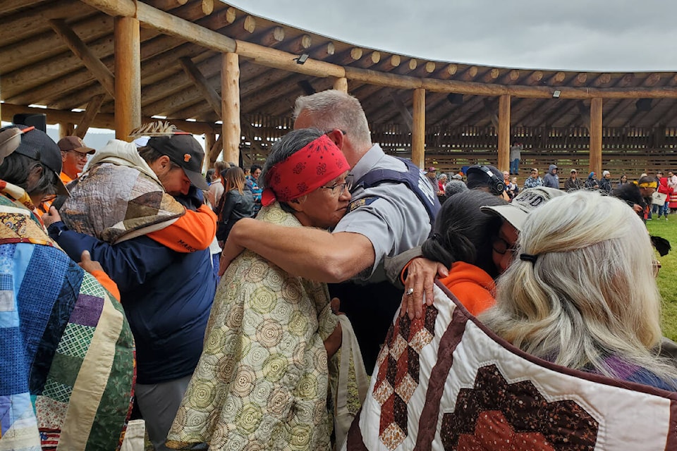Quesnel RCMP Staff Sgt. Richard Weseen gives Archie Chantyman a hug during a ceremony honouring residential school surivors on Tuesday, Sept. 19. (Monica Lamb-Yorski photo - Efteen)