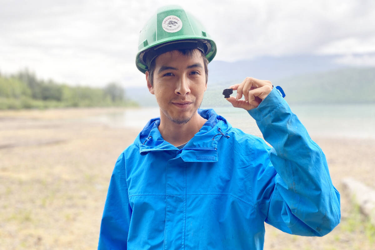 Parker Daniels, of Sugar Cane Archaeology, holds up an artifact. (Brittany Cleminson photo- Sugar Cane Archaeology)