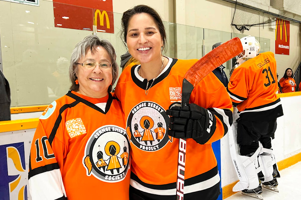 Orange Shirt Day founder Phyllis Webstad and Olympic silver medalist Brigette Laquette take part in opening ceremonies at the Every Child Matters hockey game in Williams Lake Sept. 21. (Angie Mindus photo - Williams Lake Tribune)
