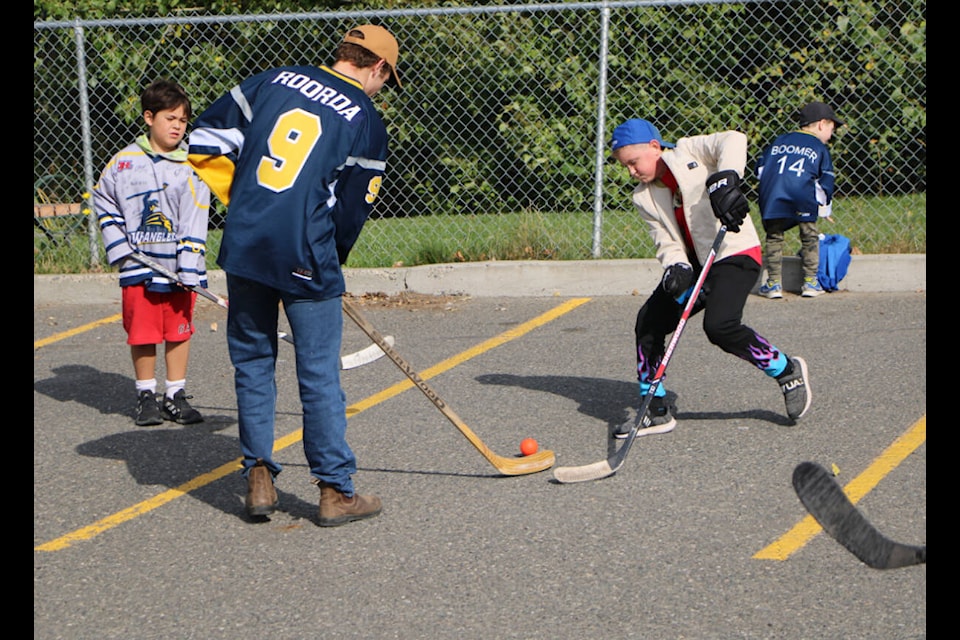 Members of the 100 Mile House Wranglers played street hockey last Saturday with members of the community. (Patrick Davies photo - 100 Mile Free Press)