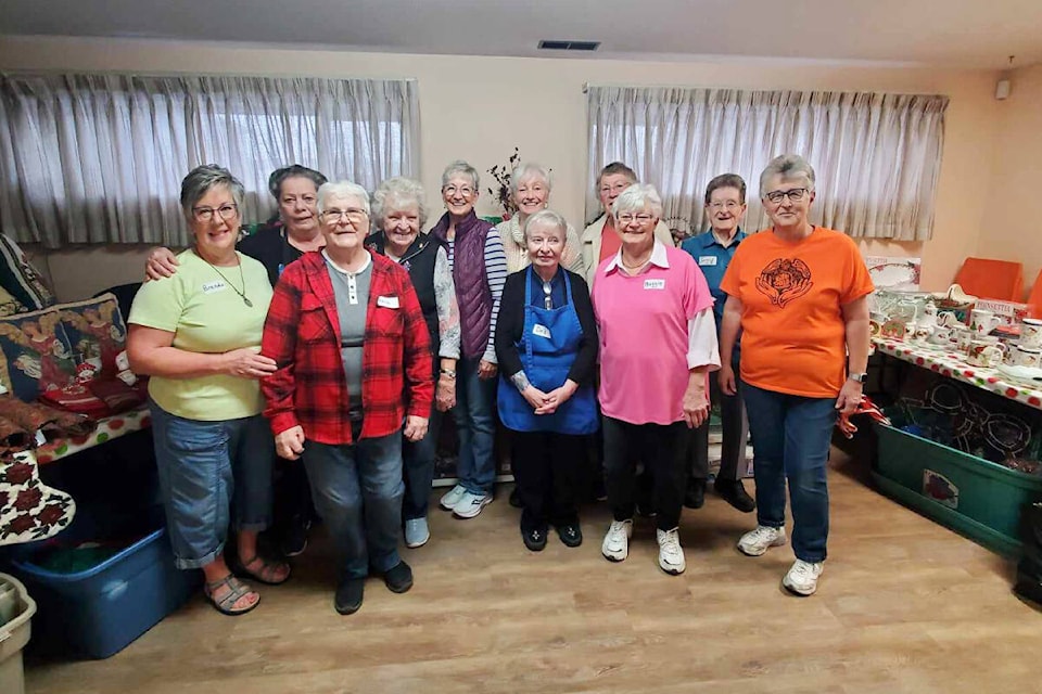 Old Age Pensioners Organization Branch 93 volunteers prepare for the doors to open at the Fall Clothing and Yard Sale Friday, Sept. 29 at the Seniors Activity Centre in Williams Lake. (Monica Lamb-Yorski photo - Williams Lake Tribune)