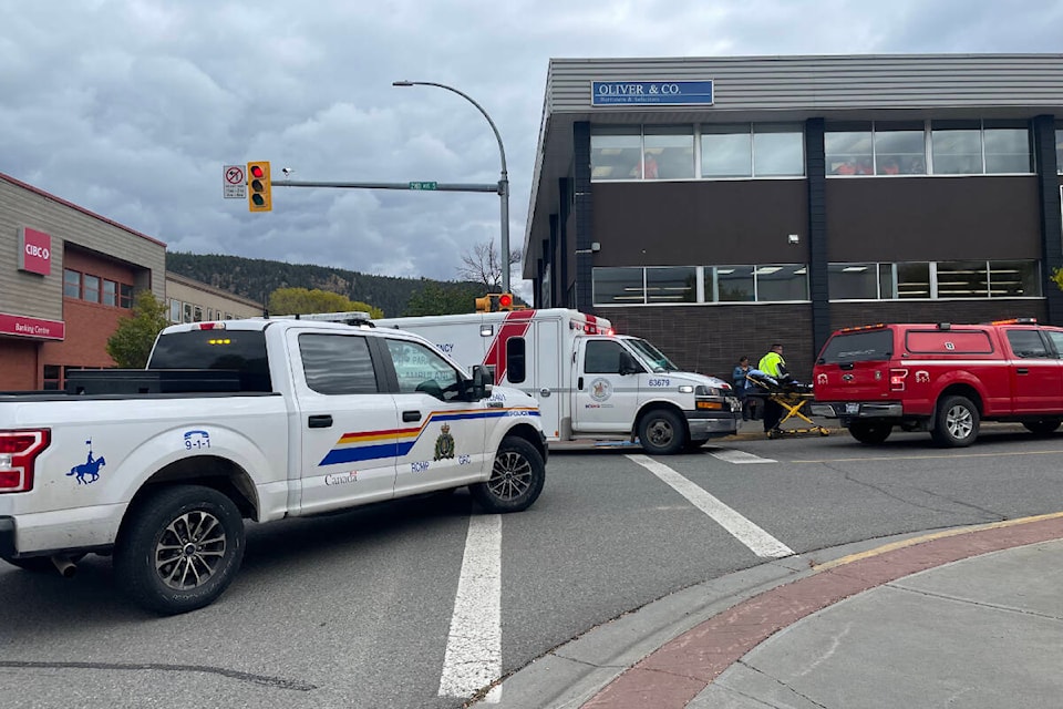 Emergency crews respond where a vehicle struck a building Friday, Sept. 29 in downtown Williams Lake. (Ruth Lloyd photo - Williams Lake Tribune)