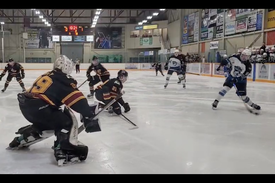 Asher Lucas goes in to score the first goal for the Williams Lake Mustangs in a game against the Quesnel River Rush Friday, Jan. 10 in Williams Lake. 