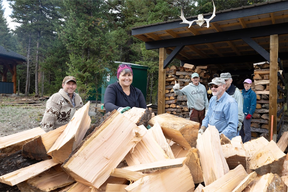 Williams Lake Cross Country Ski Club volunteers stack and load firewood as both season prep and a fundraiser.