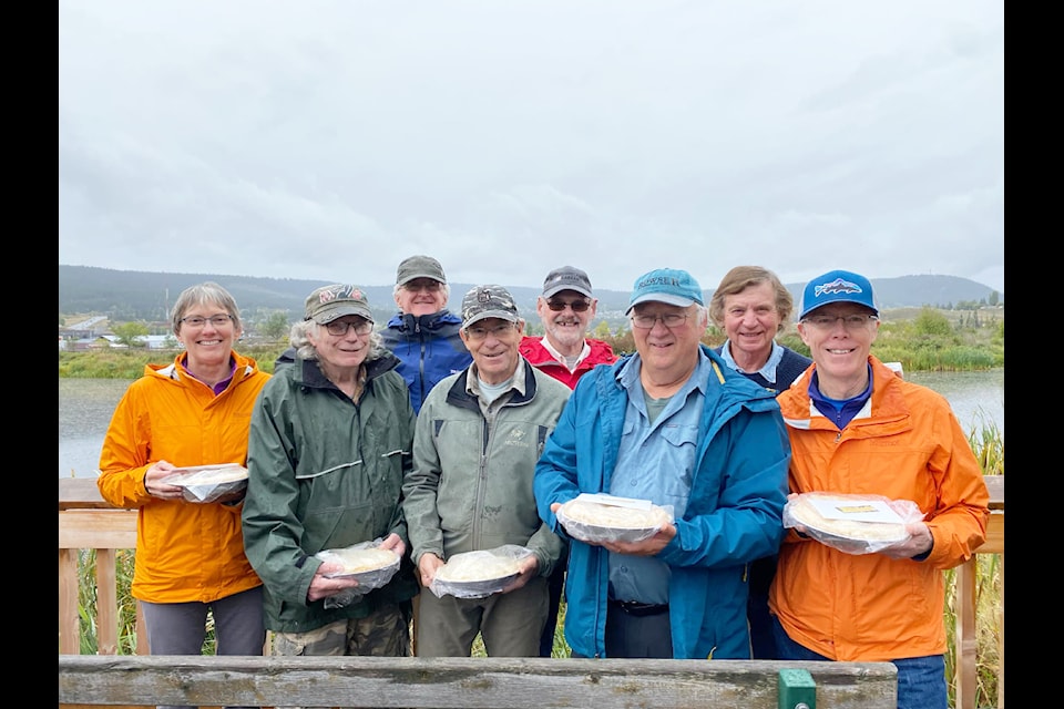 Volunteers were gifted apple pies for their outstanding work restoring the boardwalks at Scout Island. From left to right (front): Betty Donahue, Jim Buckland, Peter Opie, Rick Dawson, and Sean Donahue. From left to right (back): Rodger Hamilton, Ray Hornby and Ray Getzaf. Volunteers missing from the photo: Larry Buckland, Ordell Steen,  Ray Coupe and Don Lawrence. 