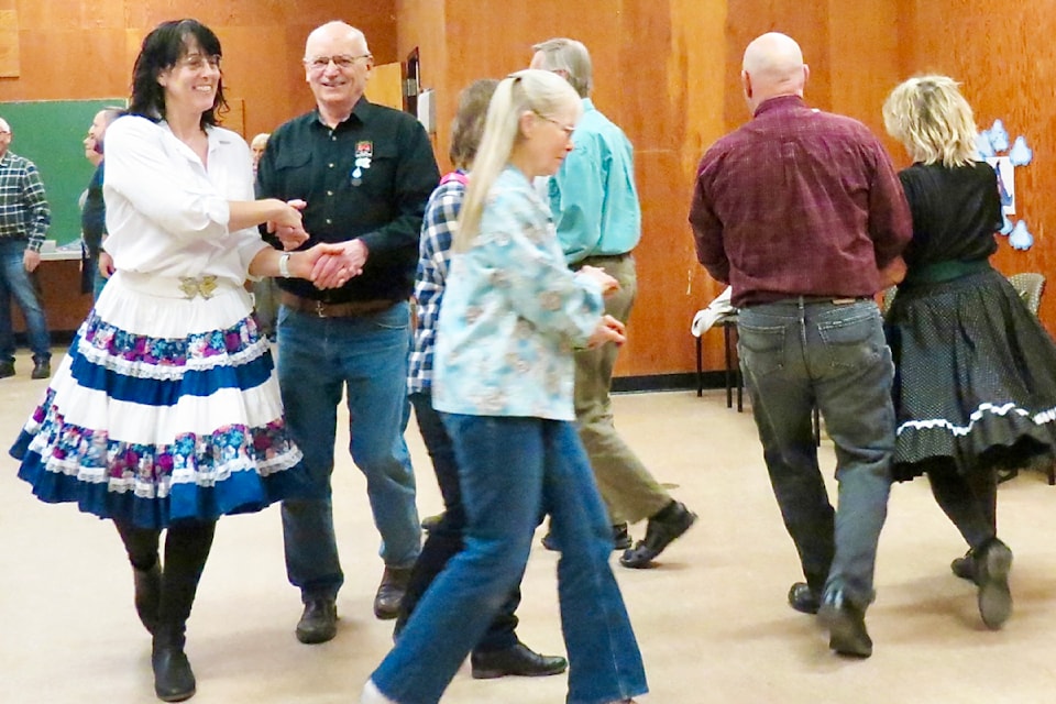 Members of the Stampede Whirlaways, which is entering its 66th season, practice the 'promenade.'     