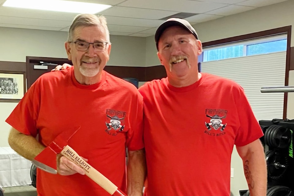 Cache Creek Volunteer Fire Department Captain Bill Elliott, left, receives his 45-year membership from Chief Tom Moe. 