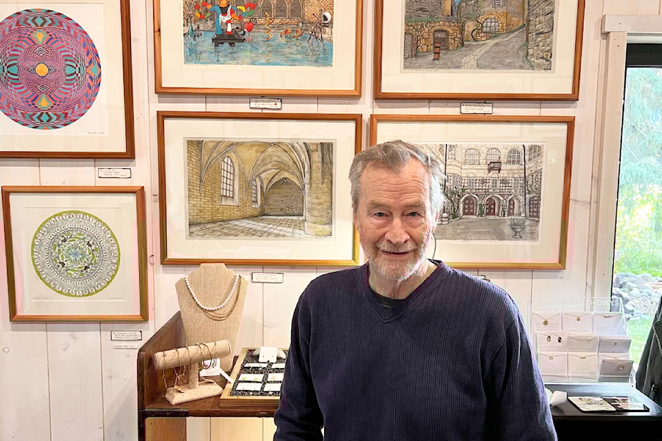 Don Gesinger sits by some of his art in Alexander Clothing, where he is part of an art show in collaboration with Pharis Romero. 