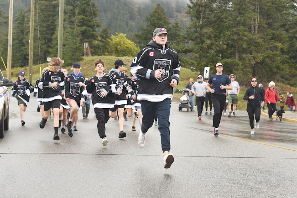 Harvest Nutrition Run participants charge out onto the route for the community event on Sept. 21. 