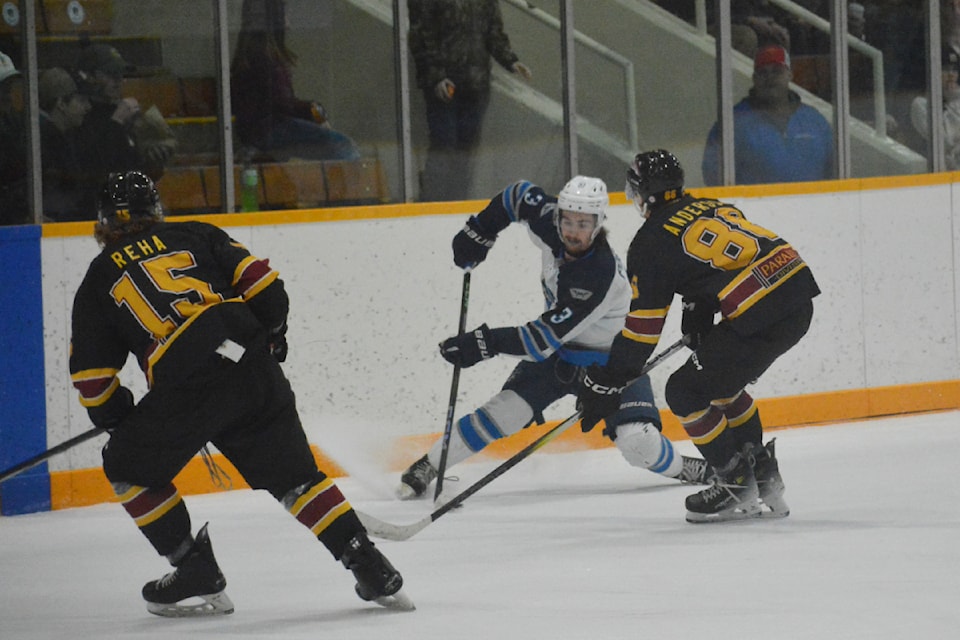 Mustang Declan Pocock controls the puck during a game against Quesnel Rush Saturday, Jan. 25 in Williams Lake. 