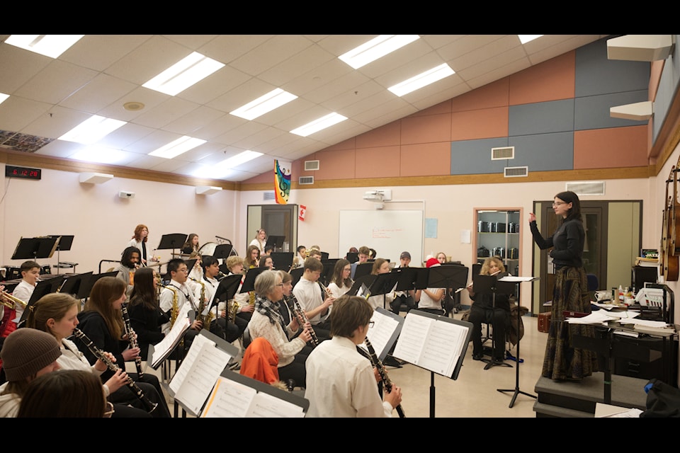 Alexandiria Miller directs the All City Band junior band as part of a rehearsal at Porter Creek Secondary on Nov. 27. (Jim Elliot/Yukon News)