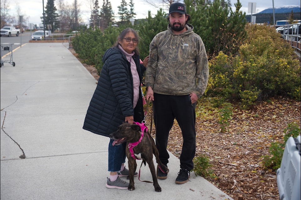 Alyce Johnson returned to the Yukon with Midnight on Oct. 7 and was greeted by her son and family friends. (Jake Howarth/Yukon News)