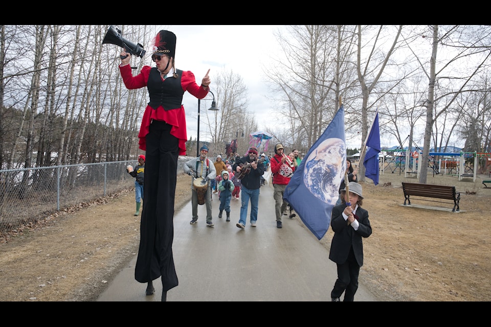 About 50 Whitehorse residents gathered for a parade along the Yukon River marking Earth Day that featured homemade puppets and musical accompaniment on April 22. (Jim Elliot/Yukon News)